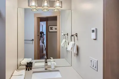 a bathroom with a sink and a mirror at Stonegate Resort Unit B303 in Big White