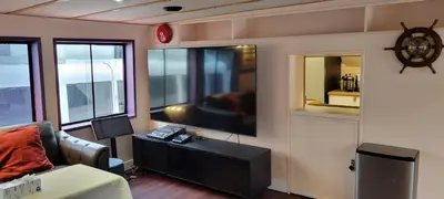 a living room with a couch and a flat screen tv at Shangri-la Cheer in Vancouver