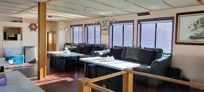 a living room with couches and tables and windows at Shangri-la Cheer in Vancouver