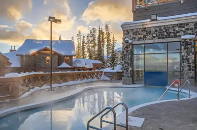 a resort swimming pool with snow on the ground at Stonegate Resort Unit A401 in Big White