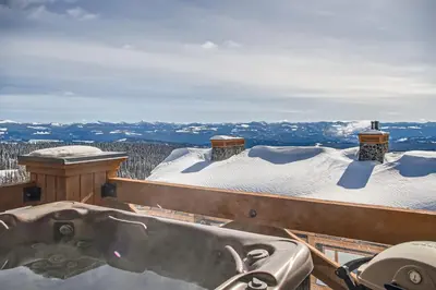 a snow covered roof with a bath tub on top at Stonegate Resort Unit A402 in Big White