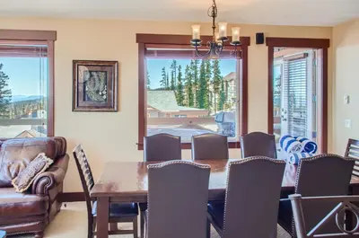 a dining room with a table and chairs at Stonegate Resort Unit C304 in Big White