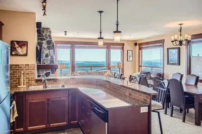 a kitchen with a sink and a counter top at Stonegate Resort Unit C304 in Big White