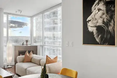 a living room with a lion picture on the wall at Elevated Elegance in Calgary