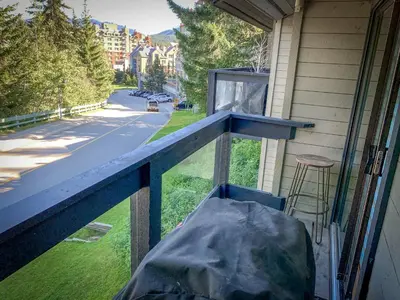 a view of a porch with a window with a table at TELEMARK 25 Ski-In Ski-Out Access Steps To Ski Lifts Renovated Townhome in Whistler