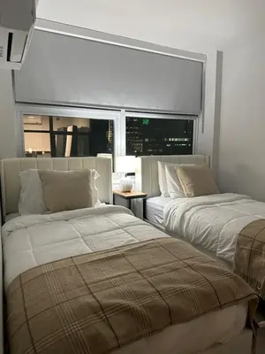 a bedroom with two beds and a window at Downtown Center Silverstone Tower I and II Home in Vancouver in Vancouver