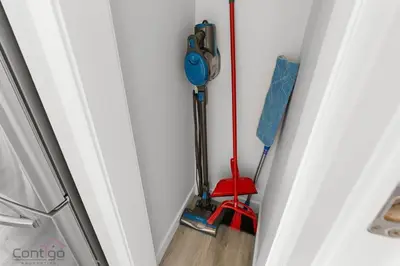 a room with a broom and a mop at Jungle House, AirCon, Sleeps 8, Near WEM & DT! in Edmonton