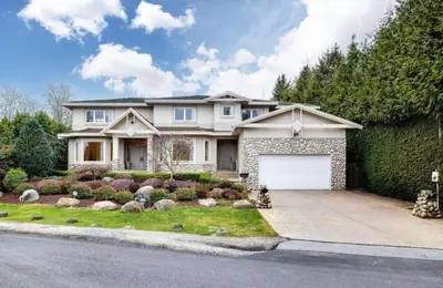 a large white house with a garage at Unitrip King bed in Richmond