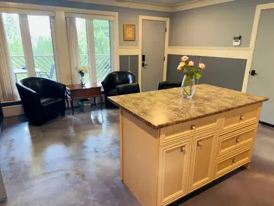 a kitchen with a counter with a vase of flowers on it at Unitrip Queen bed Room 2 in Richmond