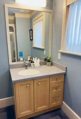 a bathroom with a sink and a mirror at Unitrip Queen bed Room 2 in Richmond