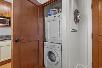 a laundry room with a washer and dryer at Luxury Rockies Retreat 1BR with Views in Canmore