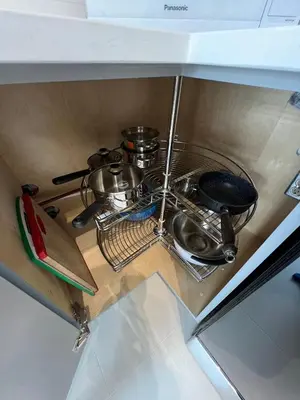 a kitchen sink with pots and pans on a counter at Waverley Guest Room in Vancouver in Vancouver