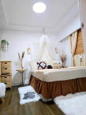 a bedroom with a large bed with a canopy at Cozy Boho Room at the Heart of Vancouver! Private Parking, Self Check-in & just 4 mins to Metrotown! in Burnaby