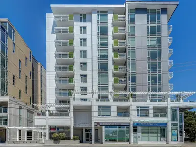 an apartment building with balconies on the side of it at The Bohemian, min 30-Day Stay with Breathtaking Views and Home Office by Victoria Prime! in Victoria