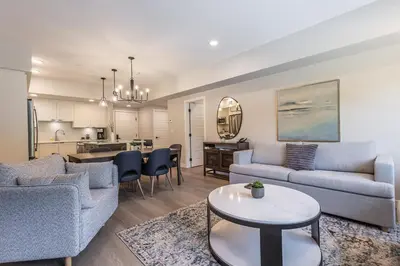 a living room with two couches and a table at Serenity at Sparrowhawk Lodge Brand New 2Bd 2Ba in Dead Man's Flats