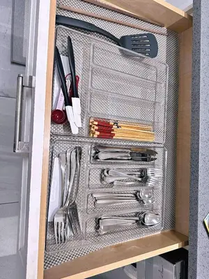a drawer filled with utensils in a refrigerator at The warm and lovely coach home in Vancouver