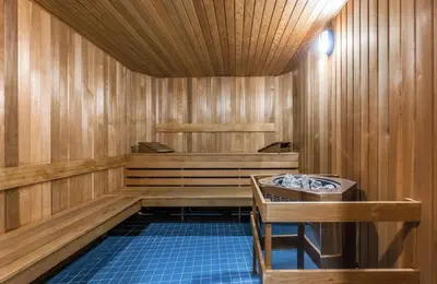 a room with a sauna with a sink in it at Stunning 1-Bedroom Condo in the Heart of Vancouver in Vancouver