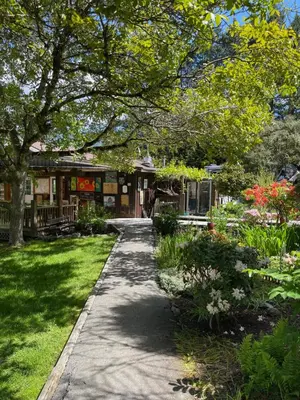 a walkway in front of a garden with flowers at Oysterbeds offers our Oyster Suite in Lund