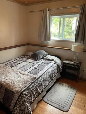 a bedroom with two beds and a window at Oysterbeds offers our Oyster Suite in Lund