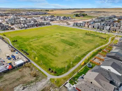 an aerial view of a large green field in a suburb at Perfect Stay 2 Bedroom Basement Suite in Airdrie