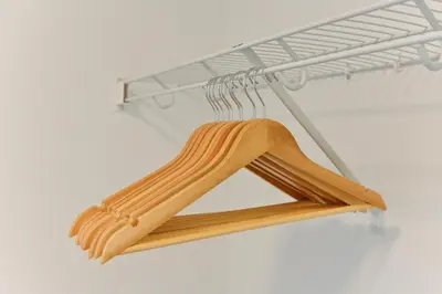 a wooden triangle hanging on a metal rack at Luxury 3 Bdrm 3 Bath townhome in Chestermere in Chestermere