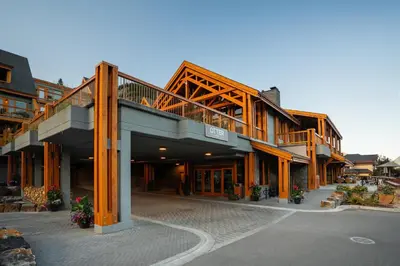 a large building with a balcony on top of it at Otter Hotel in Banff