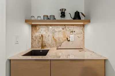 a kitchen with a sink and a counter at Otter Hotel in Banff