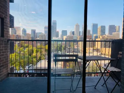 a view of a city skyline from a balcony at 6th Floor 2 Bedroom Condo with Parking in Calgary
