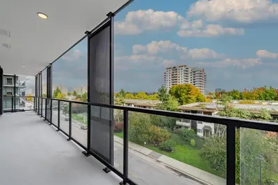 a balcony with a view of a city at Brand new Stylists Richmond central 2B2BR in Richmond