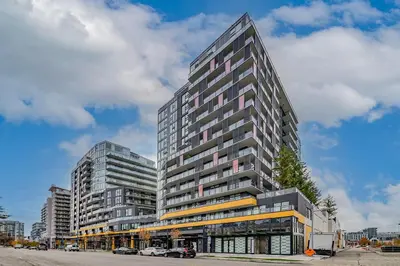 a tall building on a city street with cars at Brand new Stylists Richmond central 2B2BR in Richmond