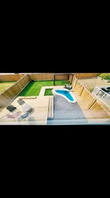 an overhead view of a swimming pool in a house at Charming & Compact Retreat in St. Albert