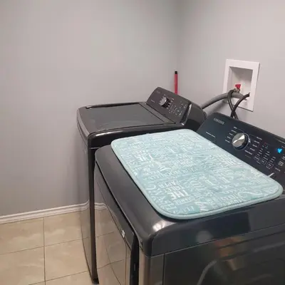 a microwave oven with a pillow on top of it at Fabulous Room in Edmonton