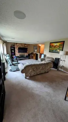 a living room with a couch and a fireplace at Spacious West Kelowna Home that is great for family, friends, or business trip! in West Kelowna