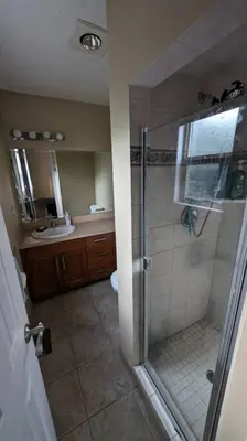 a bathroom with a shower and a sink at Spacious West Kelowna Home that is great for family, friends, or business trip! in West Kelowna