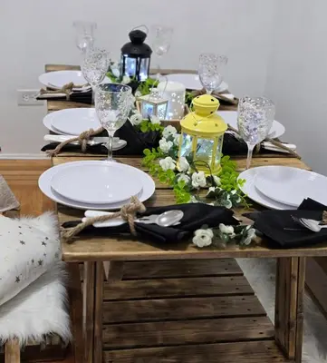 a dining table with plates and glasses on it at Spacious Private Cozy 2br Home with TeePee Dining Room! Private Parking! Self Check-in in Burnaby