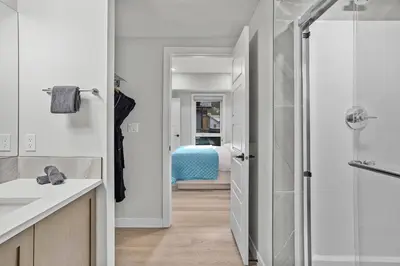a bathroom with a walk in shower and a sink at Perfect 3 bed-2 bath Top Floor Hot Tub Heated Pool Gym in Dead Man's Flats