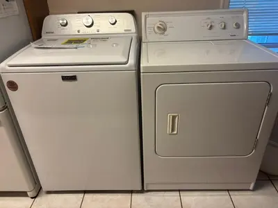 a white stove and a dishwasher next to each other at Garden Hotel 3-bedroom house for whole book in Richmond
