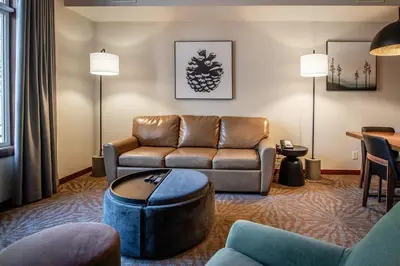 a living room with a couch and a table at Premium King suite with views and pool in Canmore