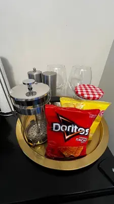 a tray with a container of chips and a bag of chips at ALL NEW 2BR Loft in Chilliwack