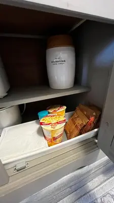 a drawer of a refrigerator with some food in it at ALL NEW 2BR Loft in Chilliwack