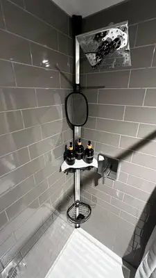 a mirror sitting on a shelf in a bathroom at ALL NEW 2BR Loft in Chilliwack