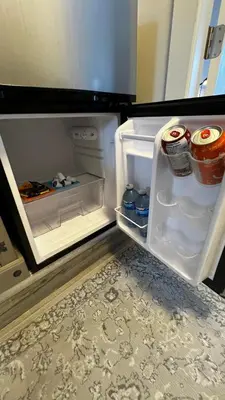 an open refrigerator with its door open and food inside at ALL NEW 2BR Loft in Chilliwack