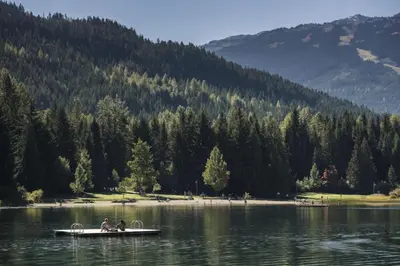 a group of people in a boat on a lake at Black Tusk - Top Floor, Best Location, Mtn Views in Whistler