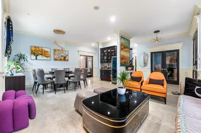 a living room with a table and a dining room at Jovehouse in Vancouver