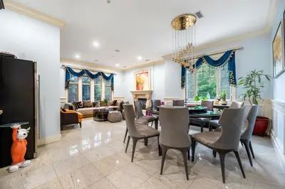 a dining room and living room with a table and chairs at Jovehouse in Vancouver