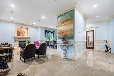 a living room with a large painting on the wall at Jovehouse in Vancouver