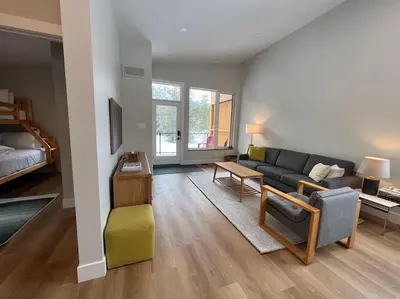 a living room with a couch and a table at 4595 Alpine Way by StayIn in Fernie