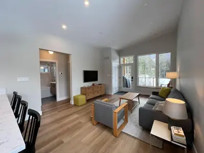 a living room with a couch and a table at 4595 Alpine Way by StayIn in Fernie