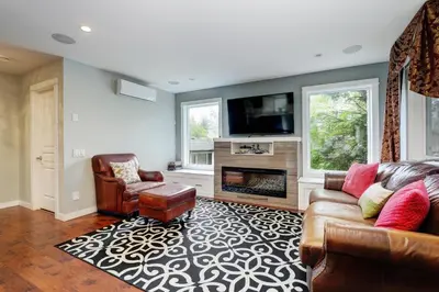 a living room with a couch and a tv at Modern Home in Victoria, BC in Victoria