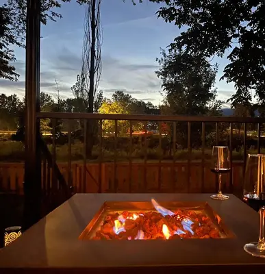 a fire pit on a table on a deck at Hikari-Okanagan Sunshine B&B in Kelowna